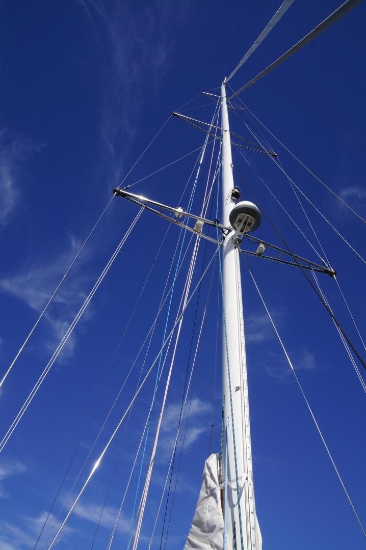a white pole with a blue sky aboard simple harmony Yacht for Sale