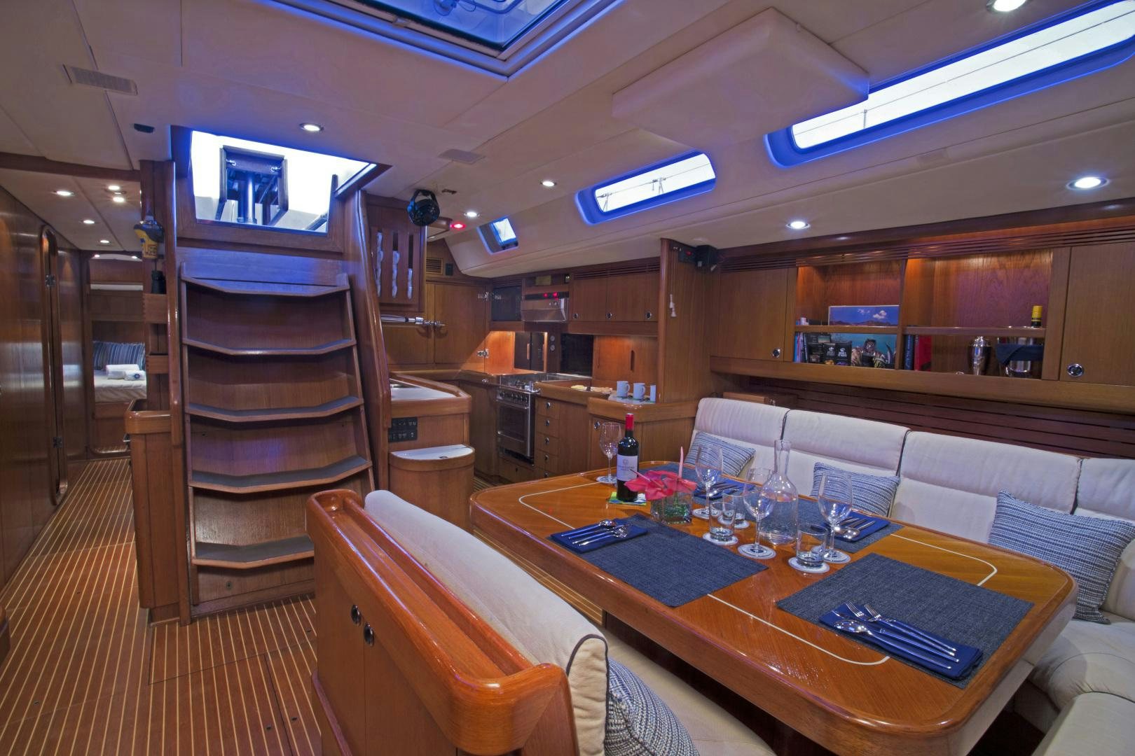 a room with a table and chairs aboard simple harmony Yacht for Sale
