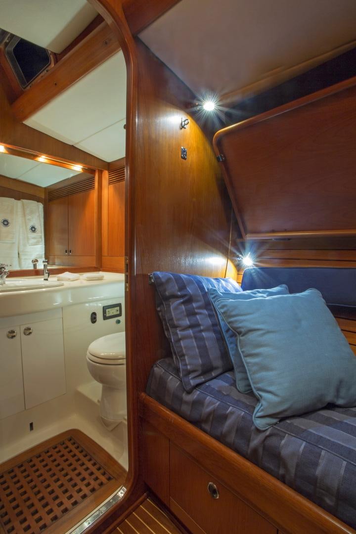 a bed in a bathroom aboard simple harmony Yacht for Sale