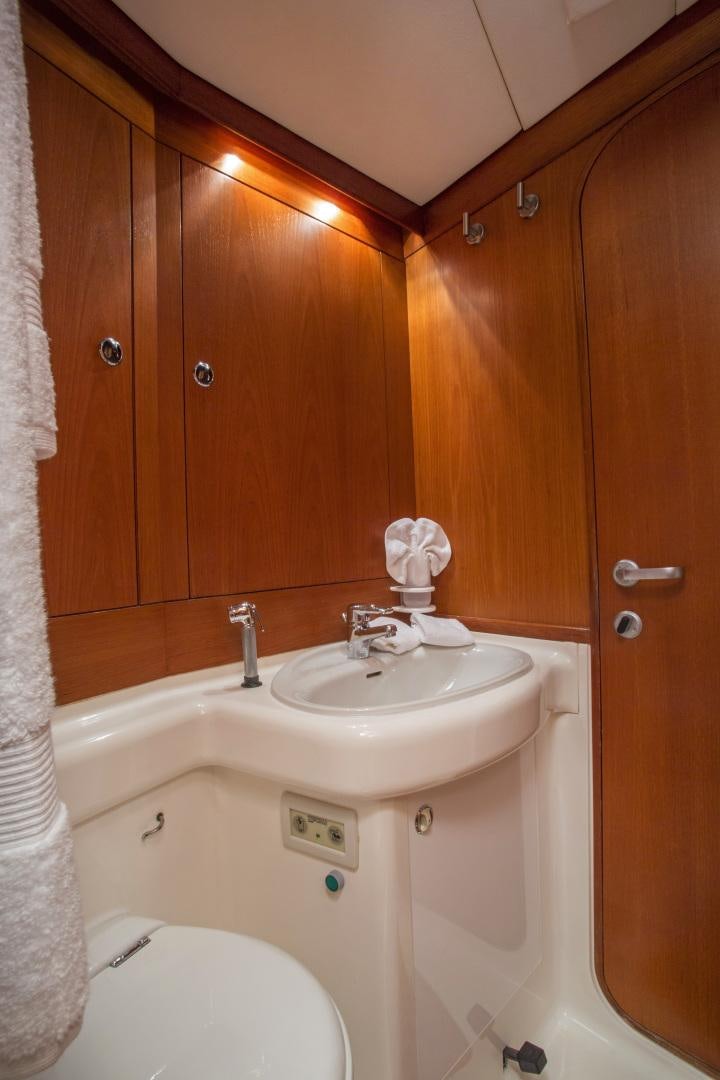 a bathroom with a sink and a toilet aboard simple harmony Yacht for Sale