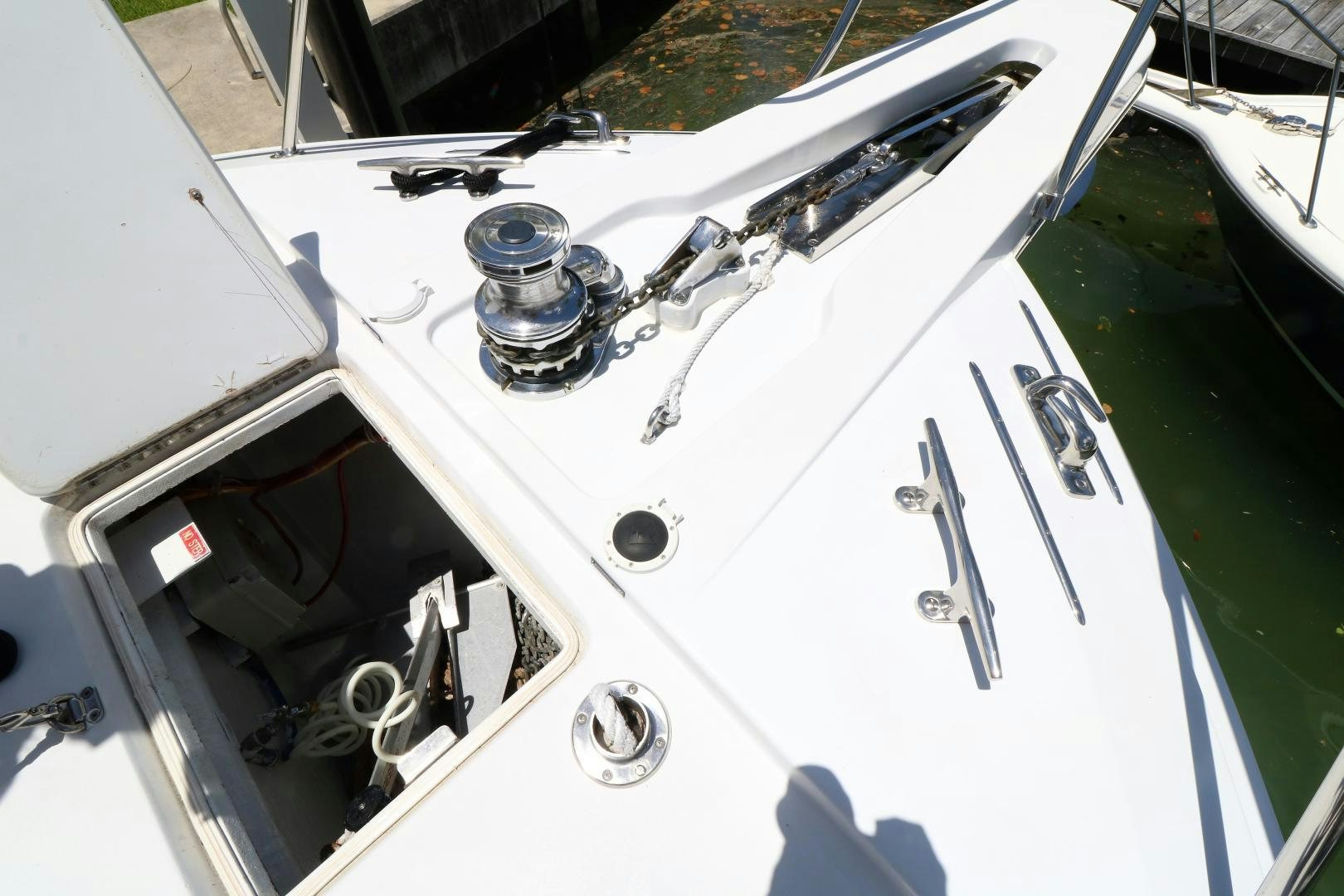 a white car with a door open aboard No Name Yacht for Sale