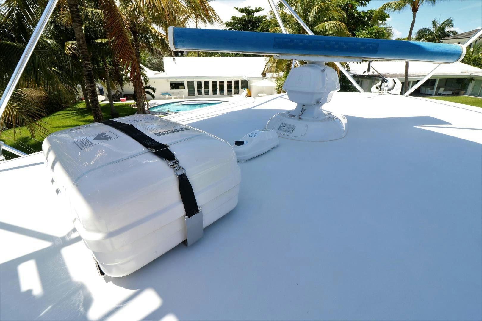 a white boat on a blue surface aboard No Name Yacht for Sale