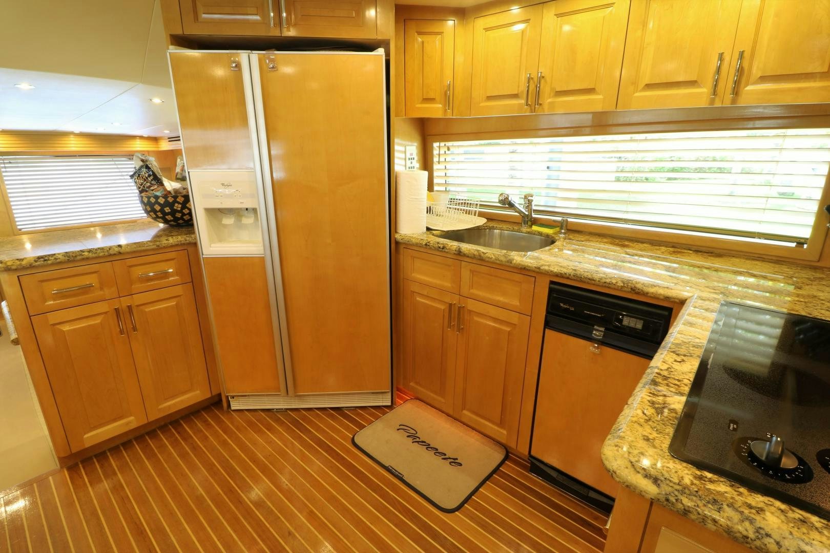 a kitchen with a stainless steel refrigerator aboard No Name Yacht for Sale