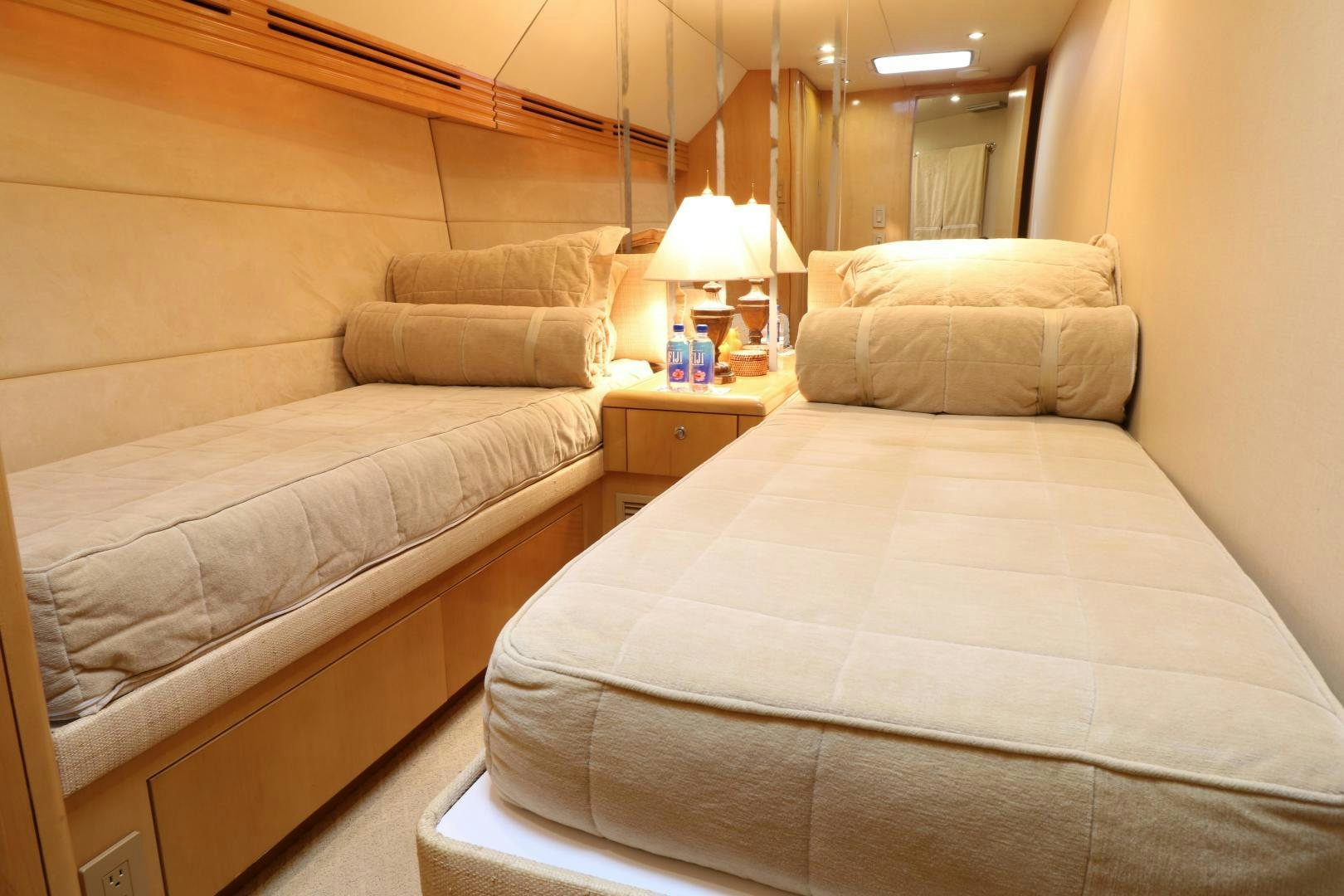 a bed with a white sheet aboard No Name Yacht for Sale