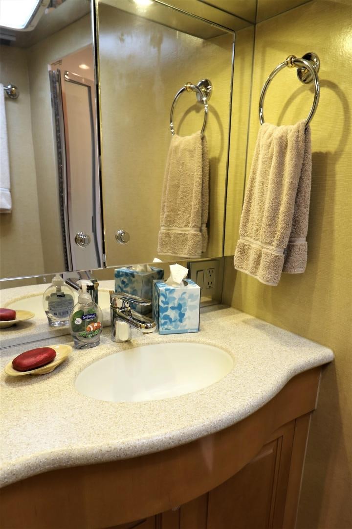 a bathroom with a sink and a mirror aboard No Name Yacht for Sale