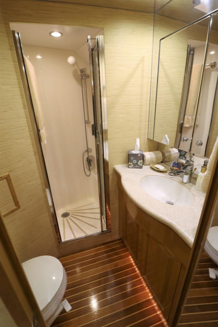 a bathroom with a shower and sink aboard No Name Yacht for Sale