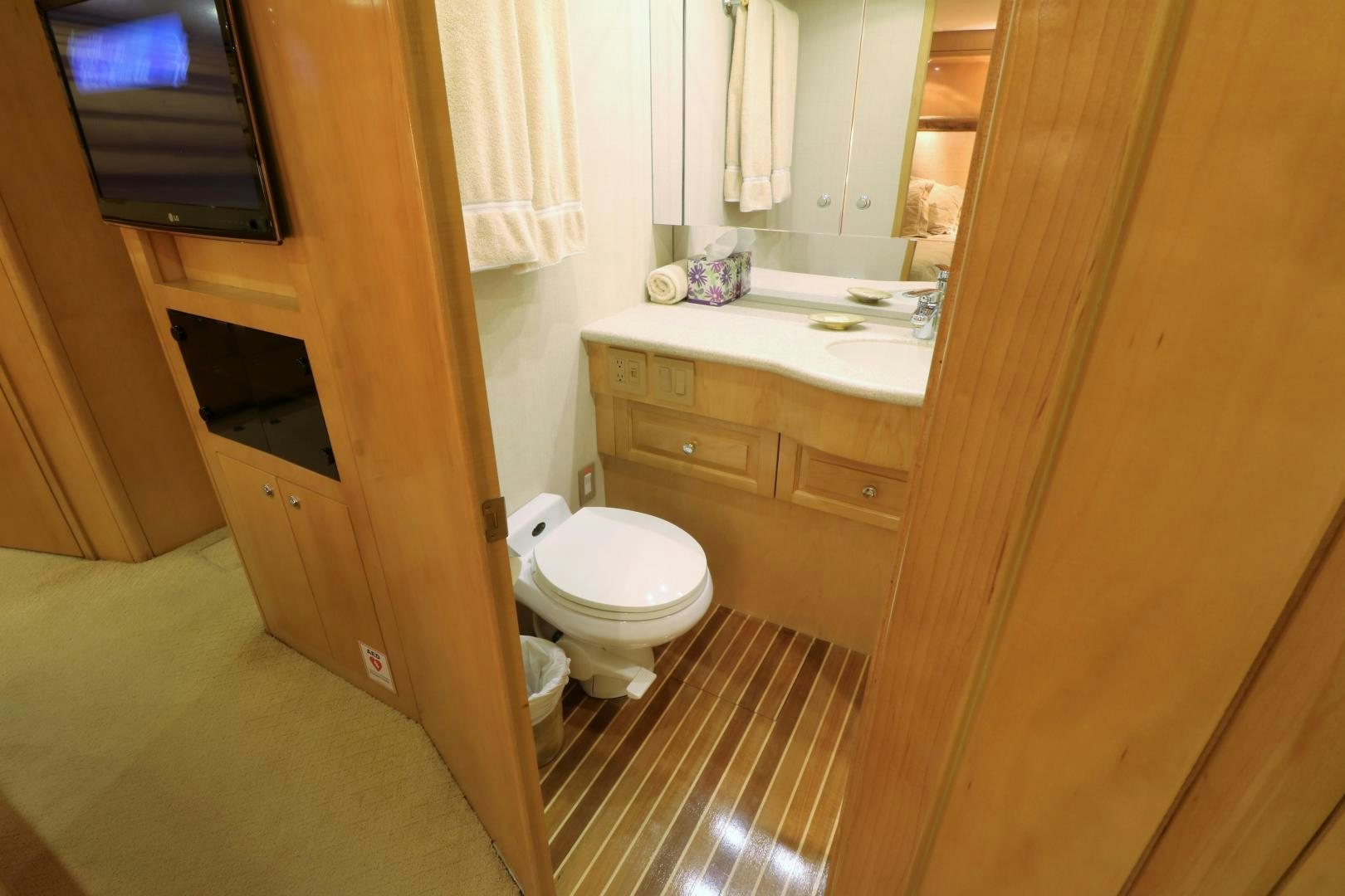 a bathroom with a toilet and a sink aboard No Name Yacht for Sale