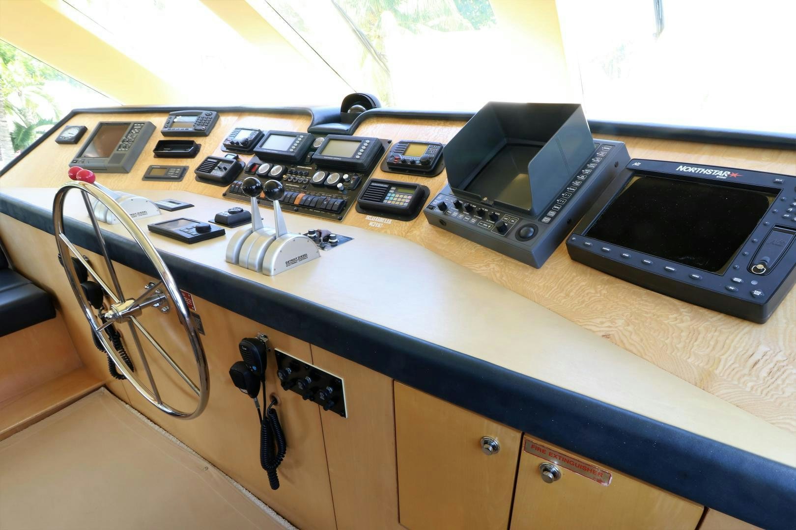 a table with a laptop and other electronics on it aboard No Name Yacht for Sale