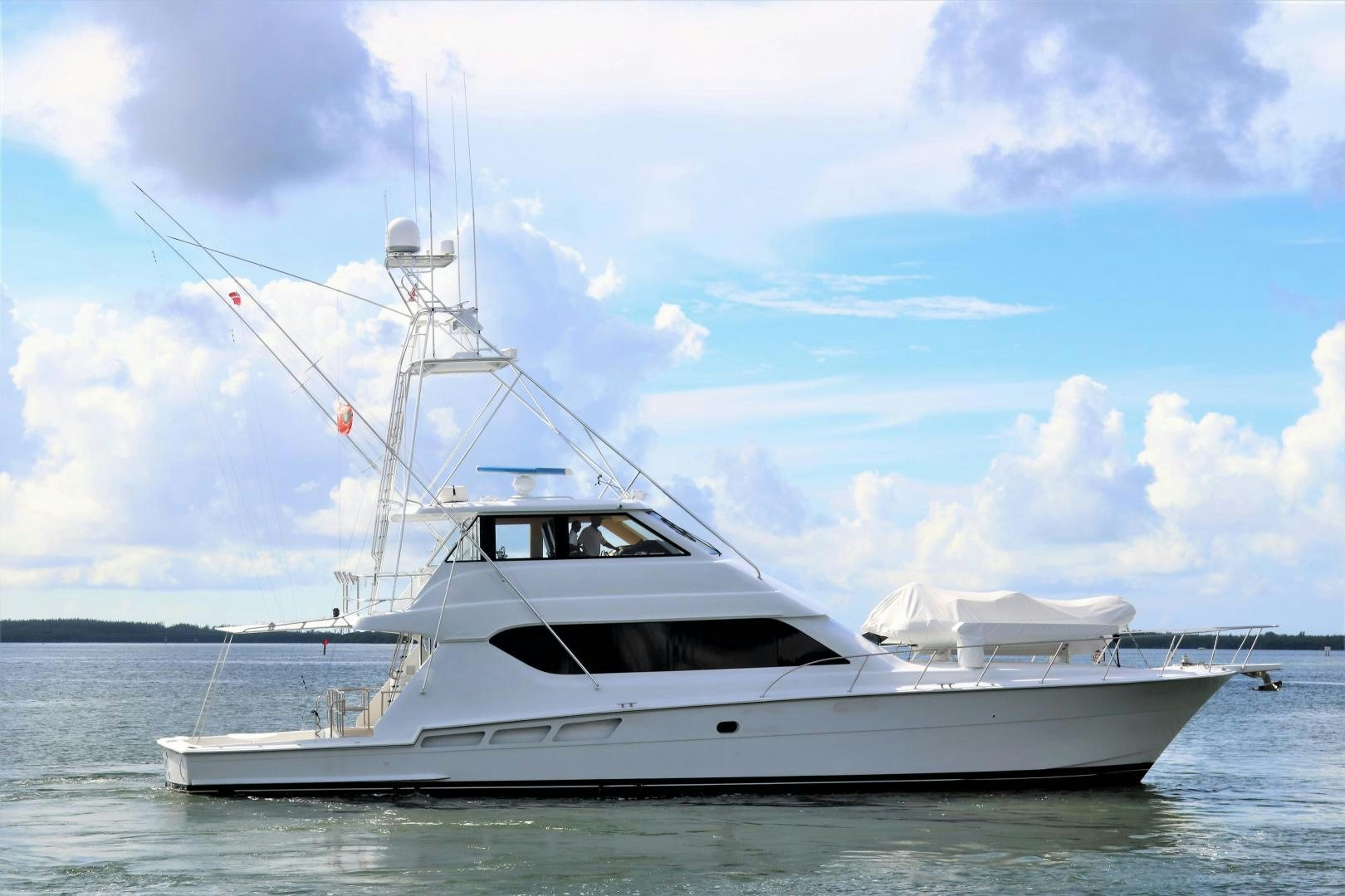 a white boat on the water aboard No Name Yacht for Sale