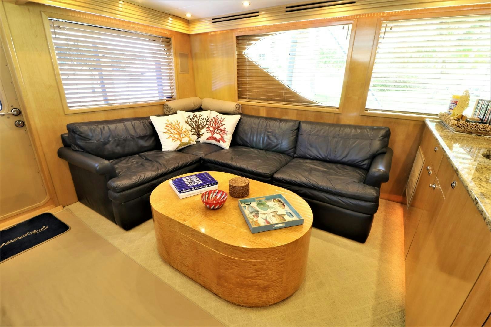 a leather couch in a kitchen aboard No Name Yacht for Sale