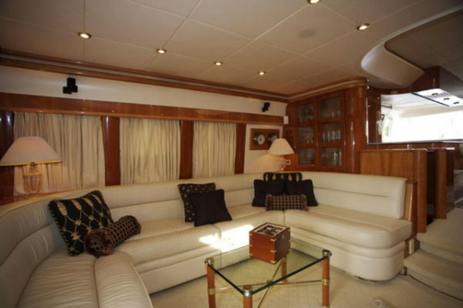 a living room with a couch and a coffee table aboard LADY KARIMAN Yacht for Sale
