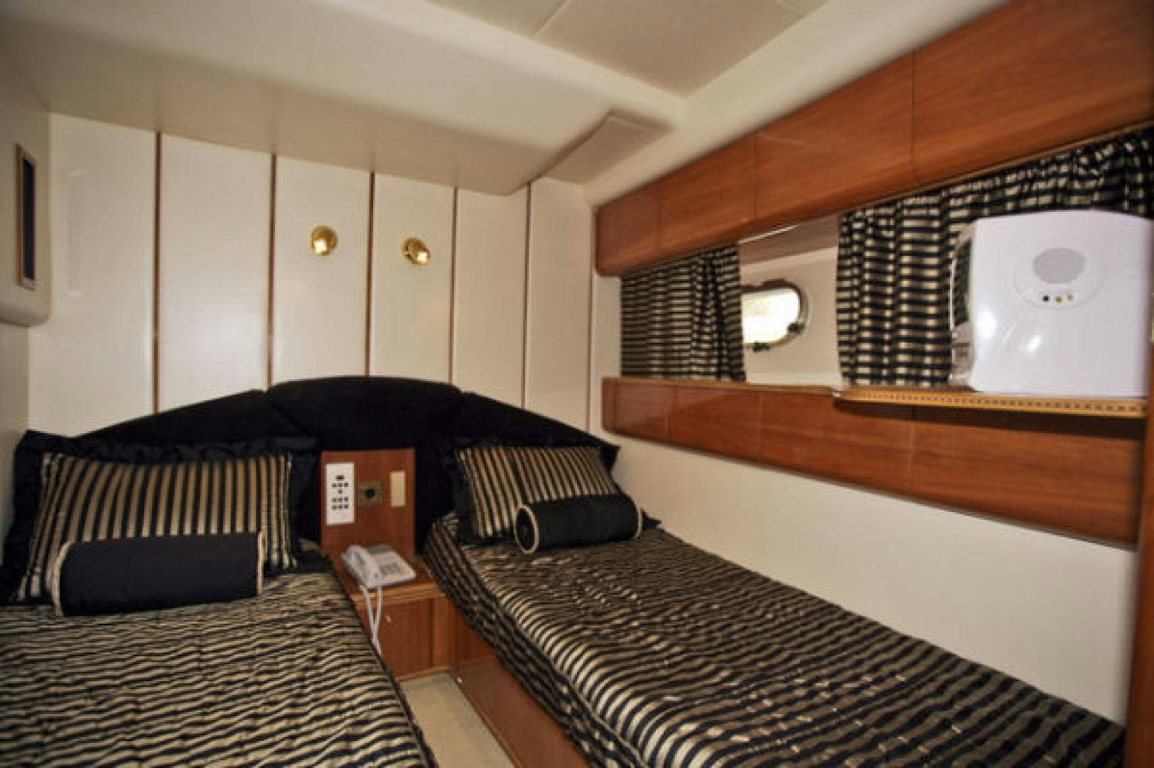 a room with a bed and a mirror aboard LADY KARIMAN Yacht for Sale