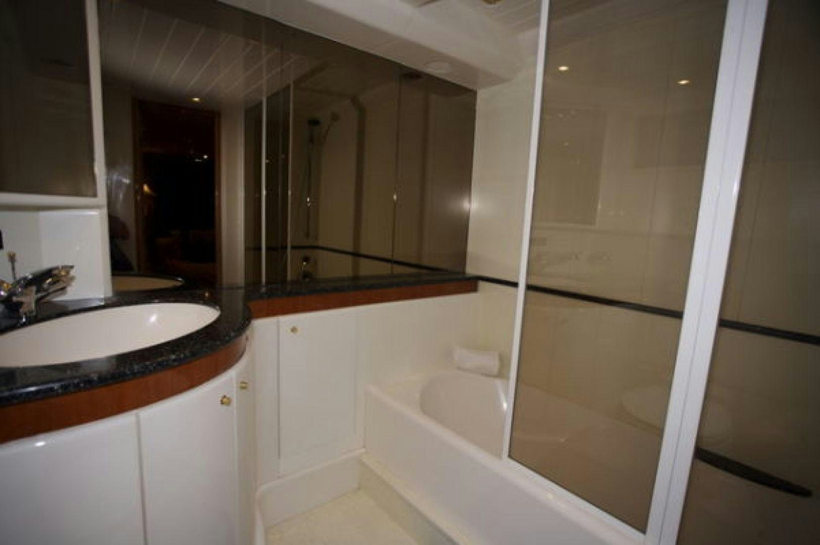a bathroom with a glass shower aboard LADY KARIMAN Yacht for Sale