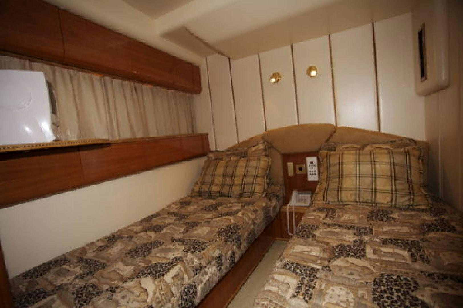 a bedroom with a bed and a couch aboard LADY KARIMAN Yacht for Sale