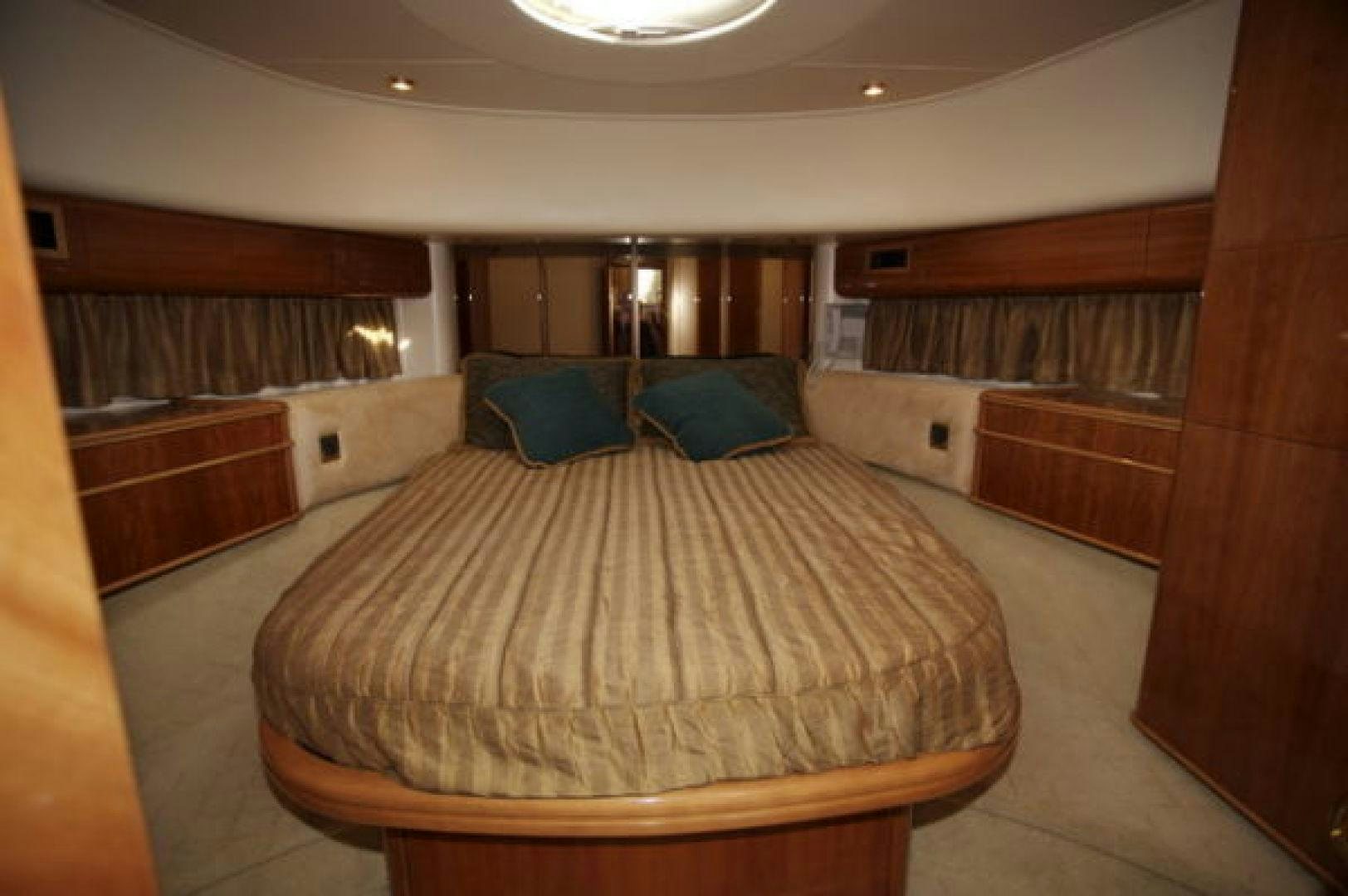 a room with a bed and a window aboard LADY KARIMAN Yacht for Sale