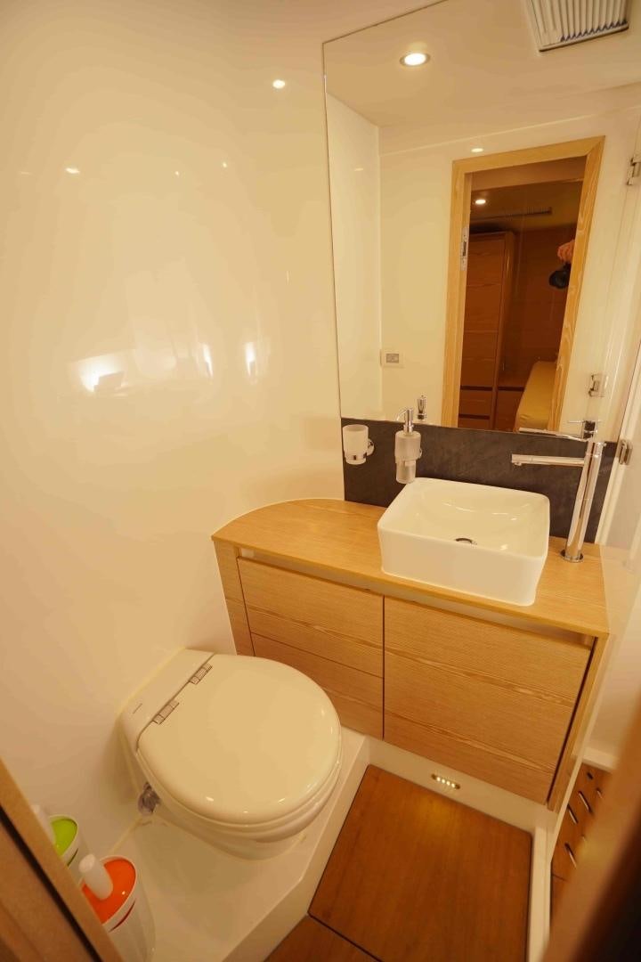 a bathroom with a sink and a toilet aboard horizon Yacht for Sale