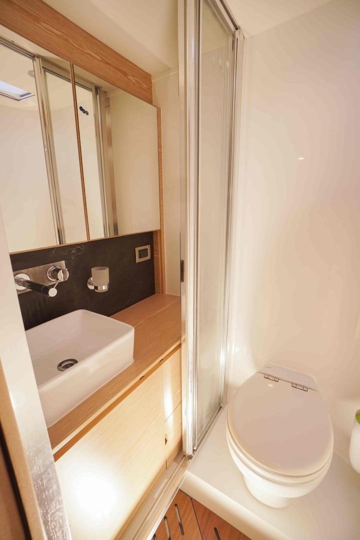 a bathroom with a sink and a toilet aboard horizon Yacht for Sale