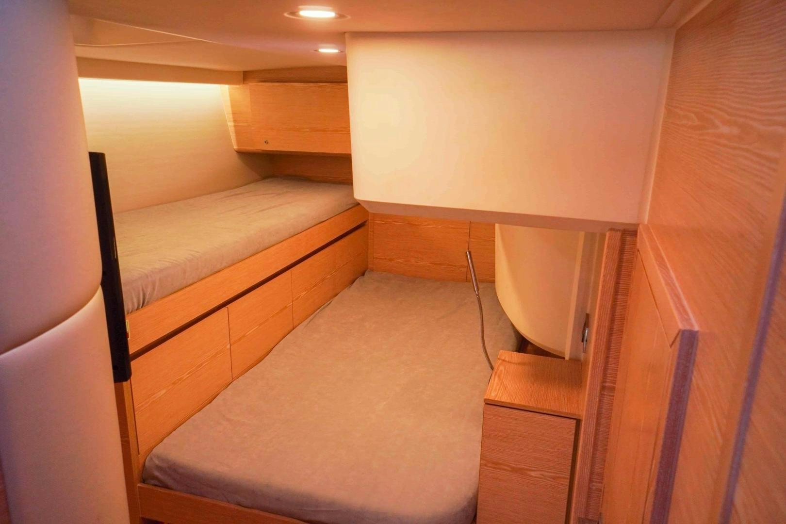 a room with a bed and a desk aboard horizon Yacht for Sale