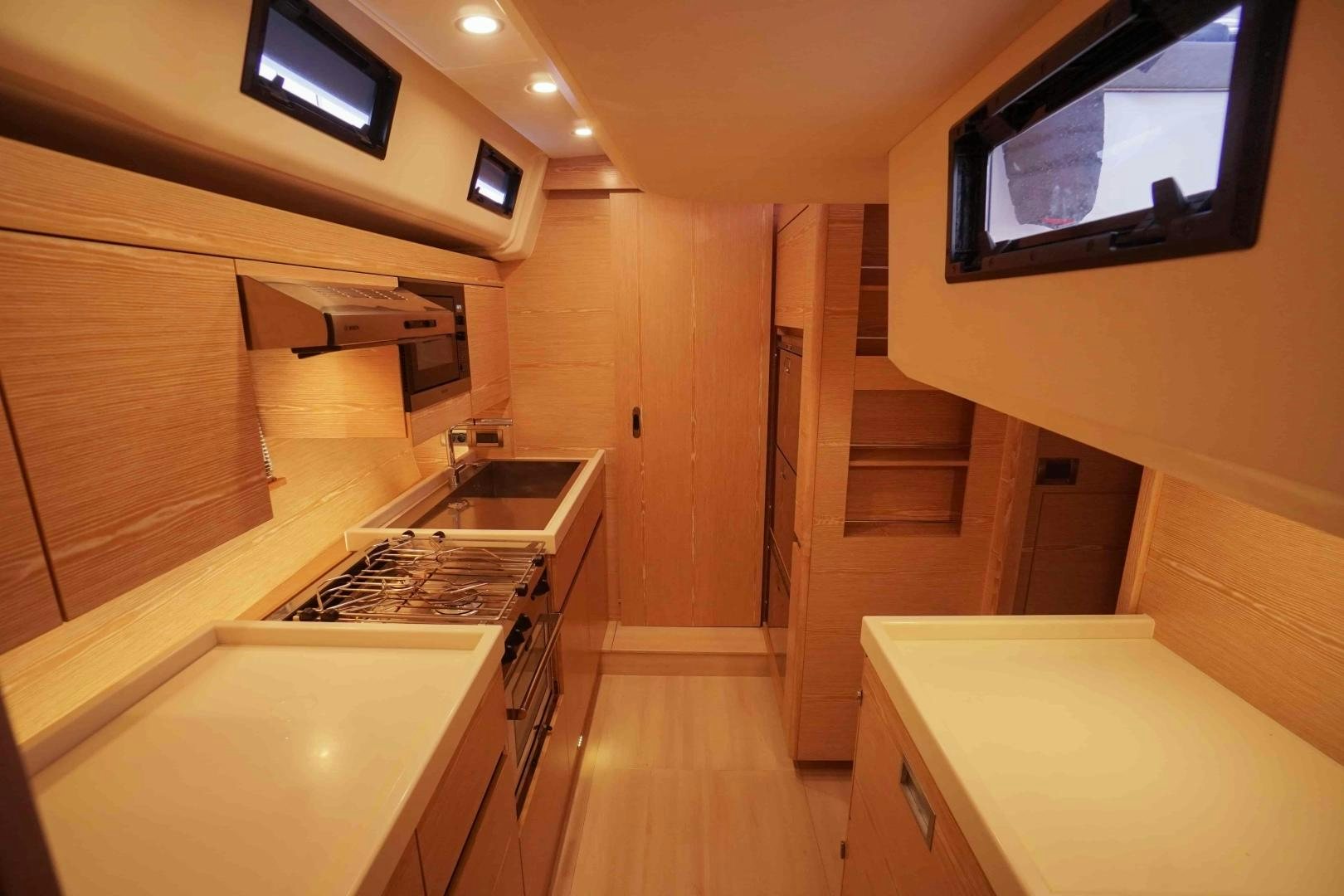 a kitchen with a large window aboard horizon Yacht for Sale