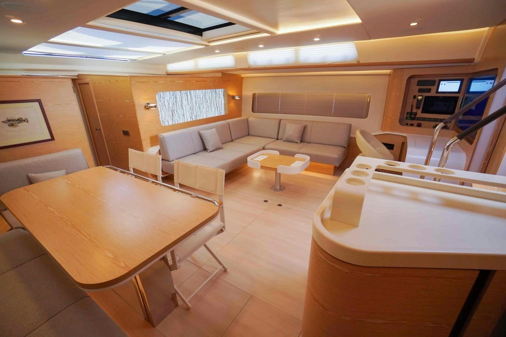 a room with couches and tables aboard horizon Yacht for Sale