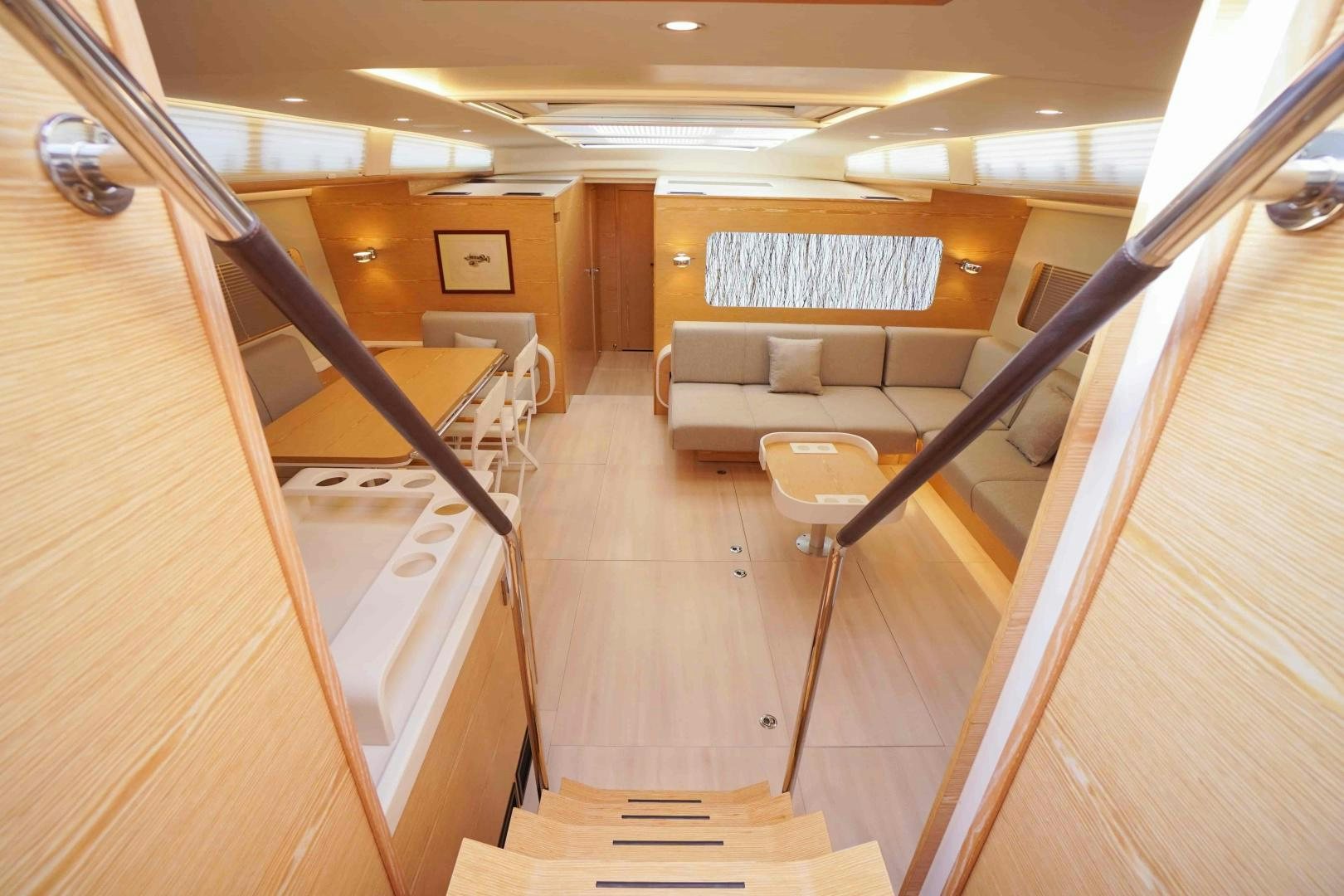 a room with a couch and a table aboard horizon Yacht for Sale