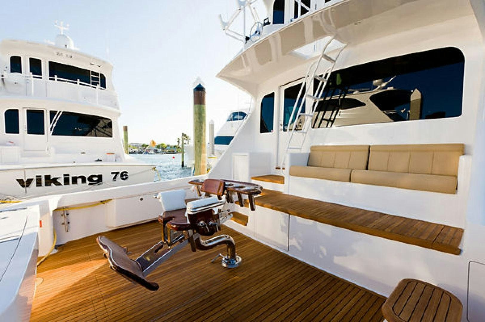 a room with a large white boat and a bench aboard NO NAME 68 Yacht for Sale
