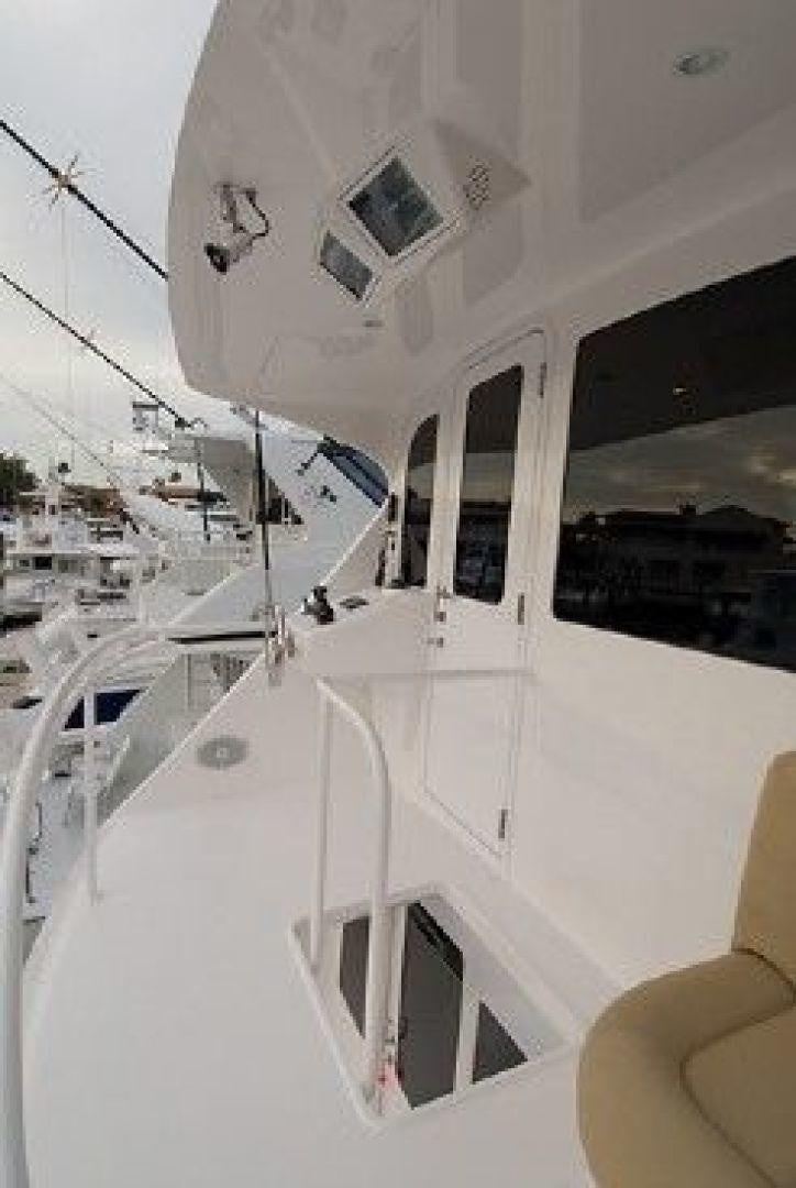 a white boat with windows aboard NO NAME 68 Yacht for Sale