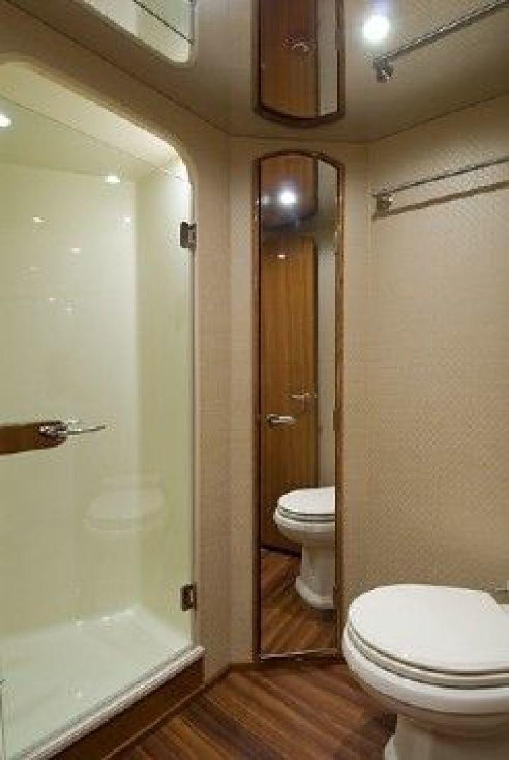 a bathroom with a toilet and a shower aboard NO NAME 68 Yacht for Sale