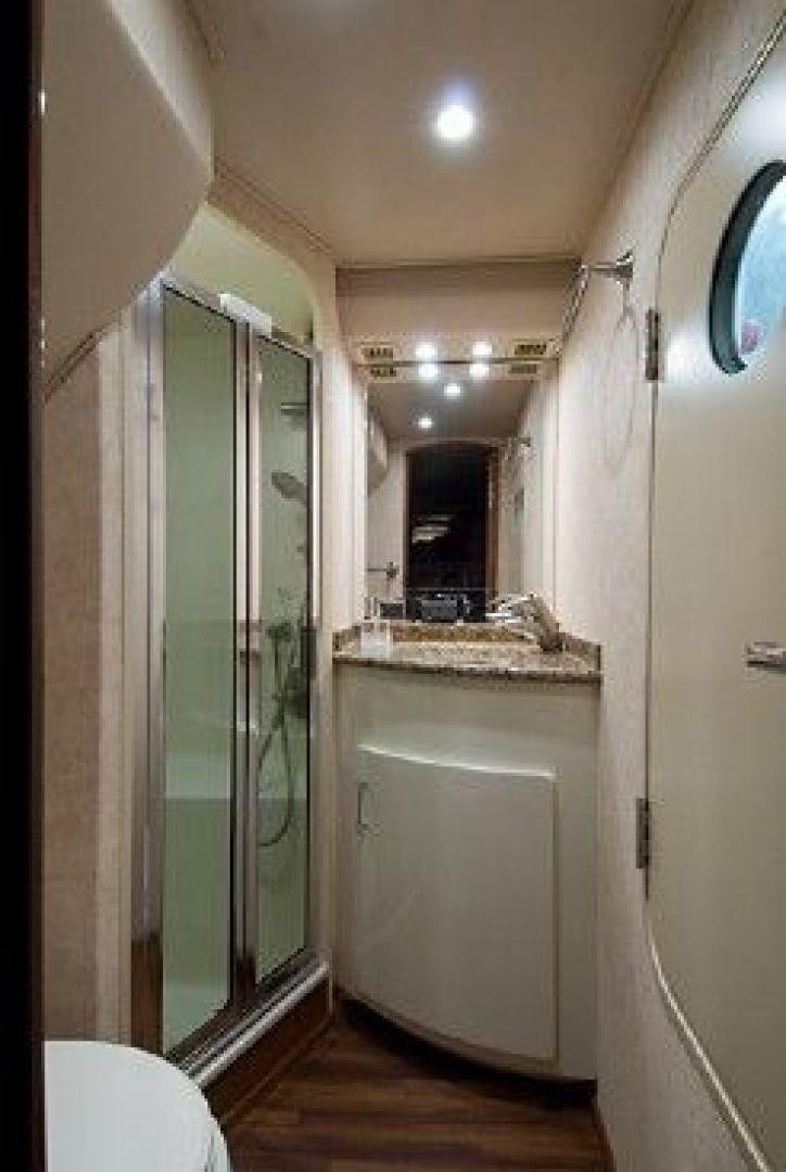 a bathroom with a glass shower aboard NO NAME 68 Yacht for Sale