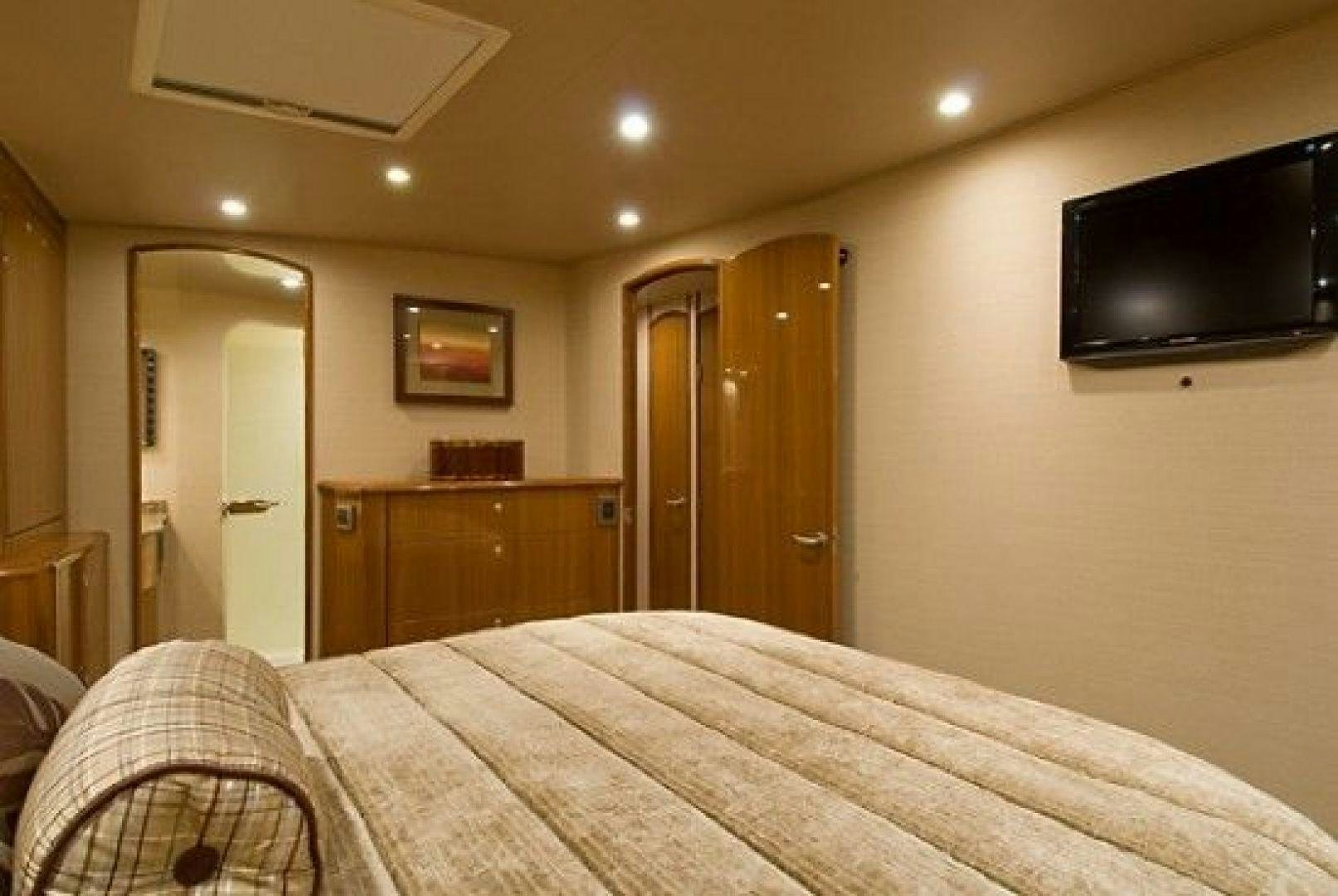 a bedroom with a bed and tv aboard NO NAME 68 Yacht for Sale