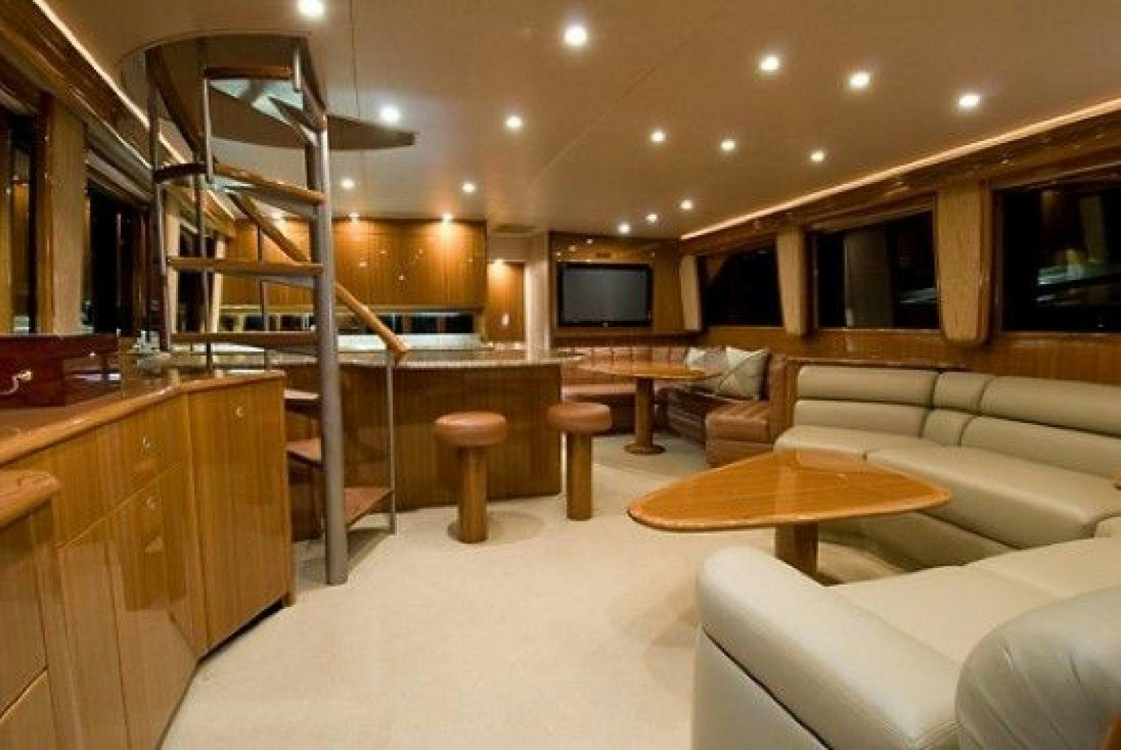 a living room with a ladder aboard NO NAME 68 Yacht for Sale