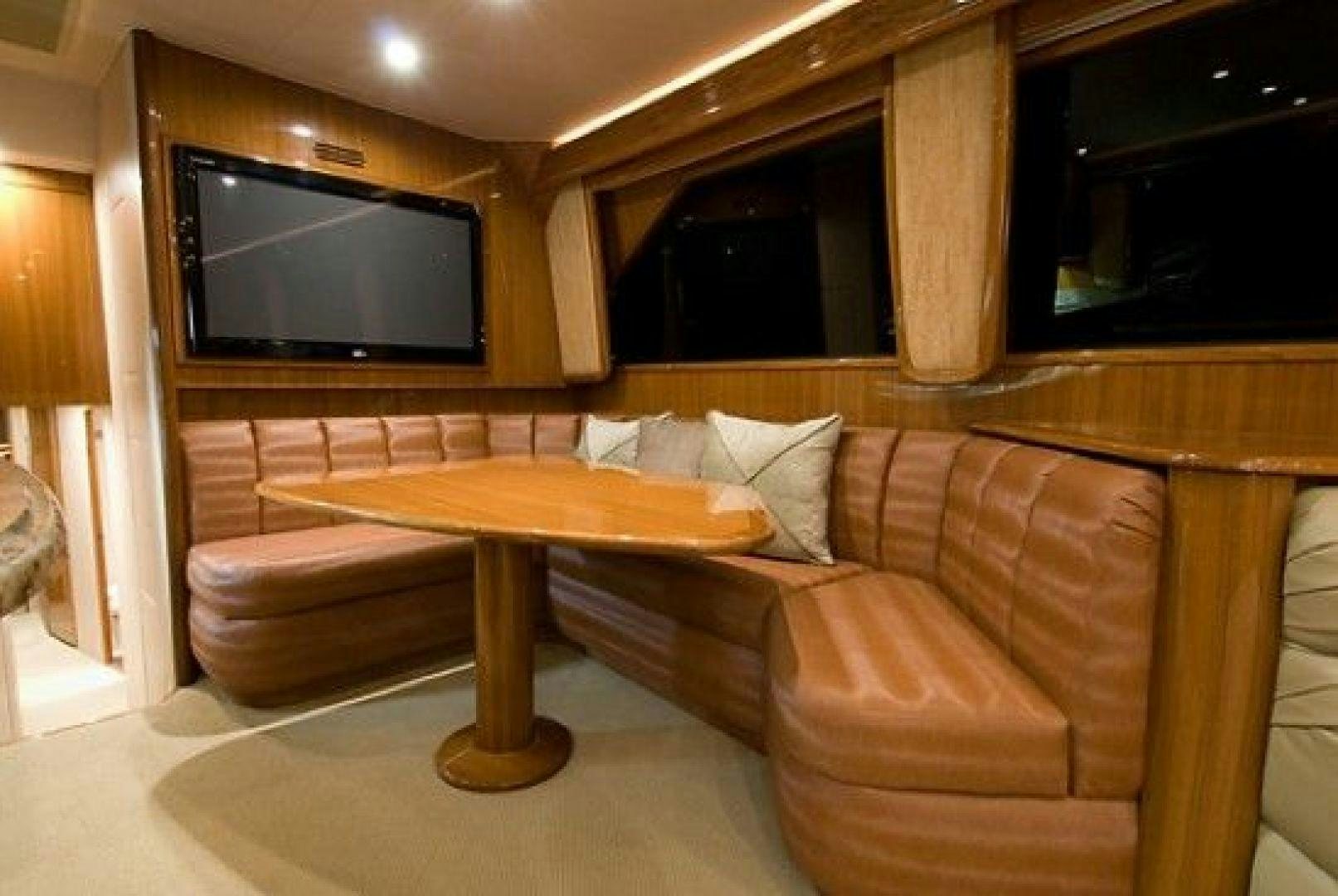 a living room with a couch and a television aboard NO NAME 68 Yacht for Sale