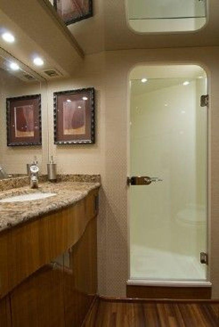 a bathroom with a sink and a mirror aboard NO NAME 68 Yacht for Sale
