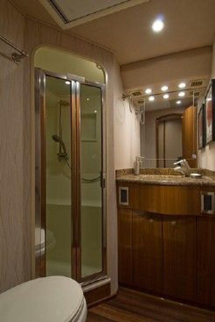 a bathroom with a glass shower door aboard NO NAME 68 Yacht for Sale