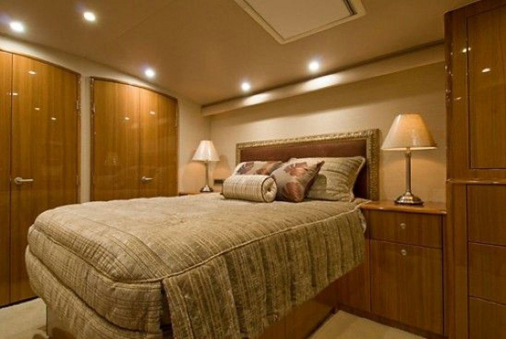 a bed with a lamp on it aboard NO NAME 68 Yacht for Sale