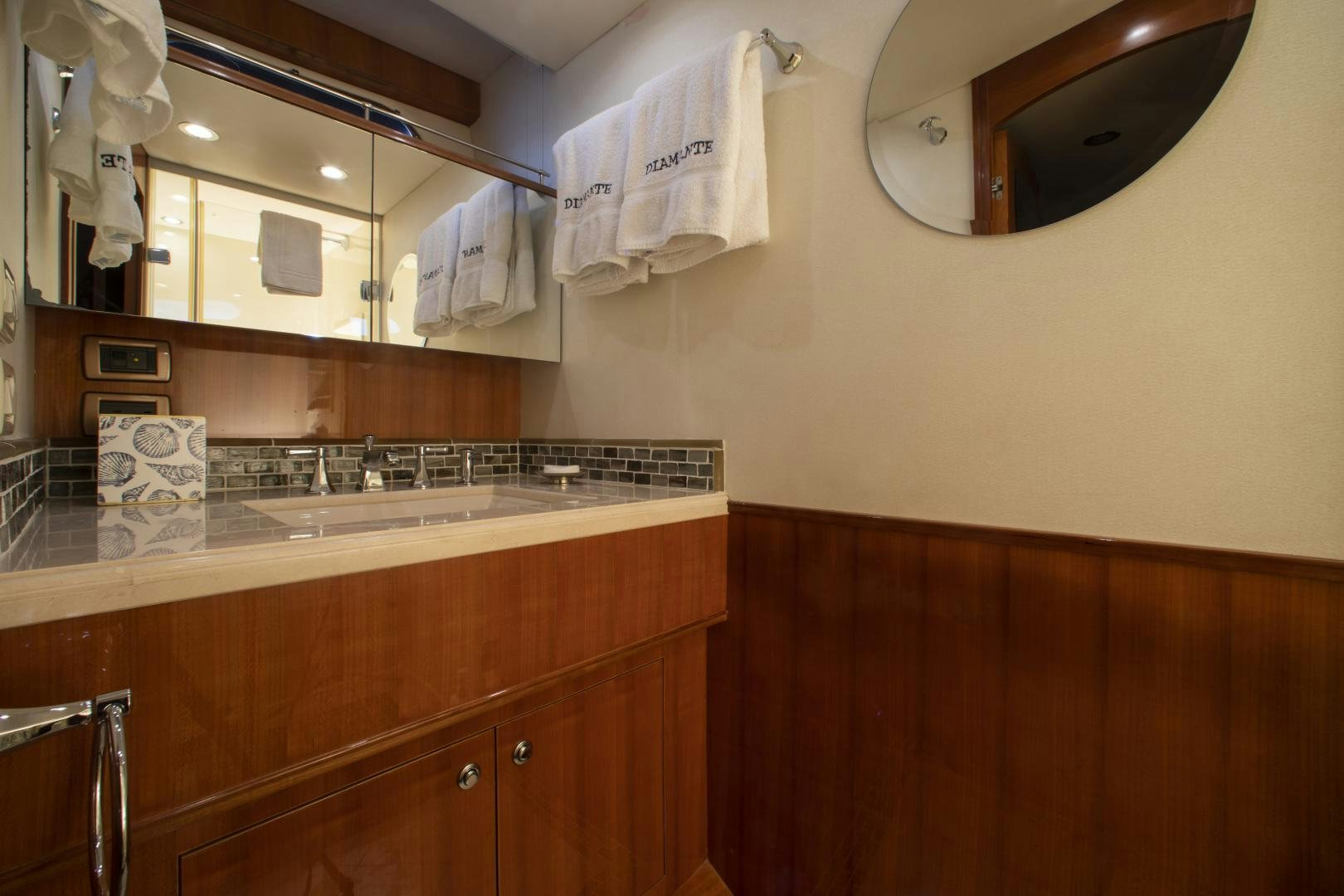 a bathroom with a sink and a mirror aboard DIAMANTE  Yacht for Sale