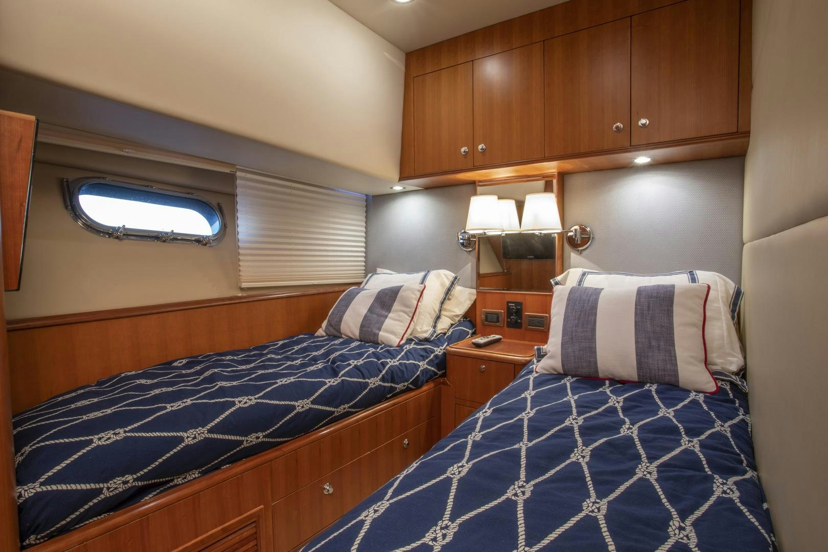 a bedroom with two beds aboard DIAMANTE  Yacht for Sale