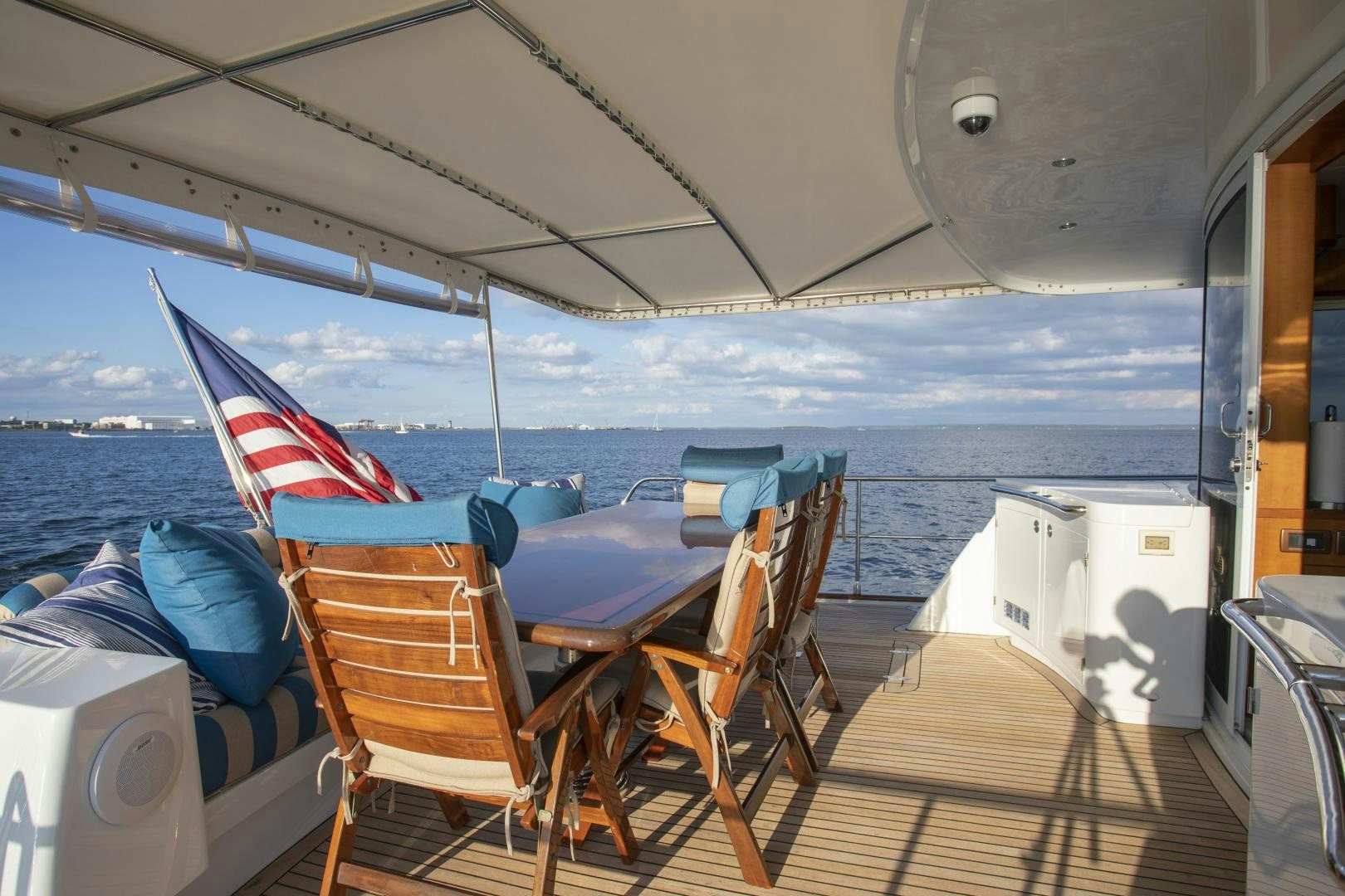 a deck with chairs and an umbrella aboard DIAMANTE  Yacht for Sale