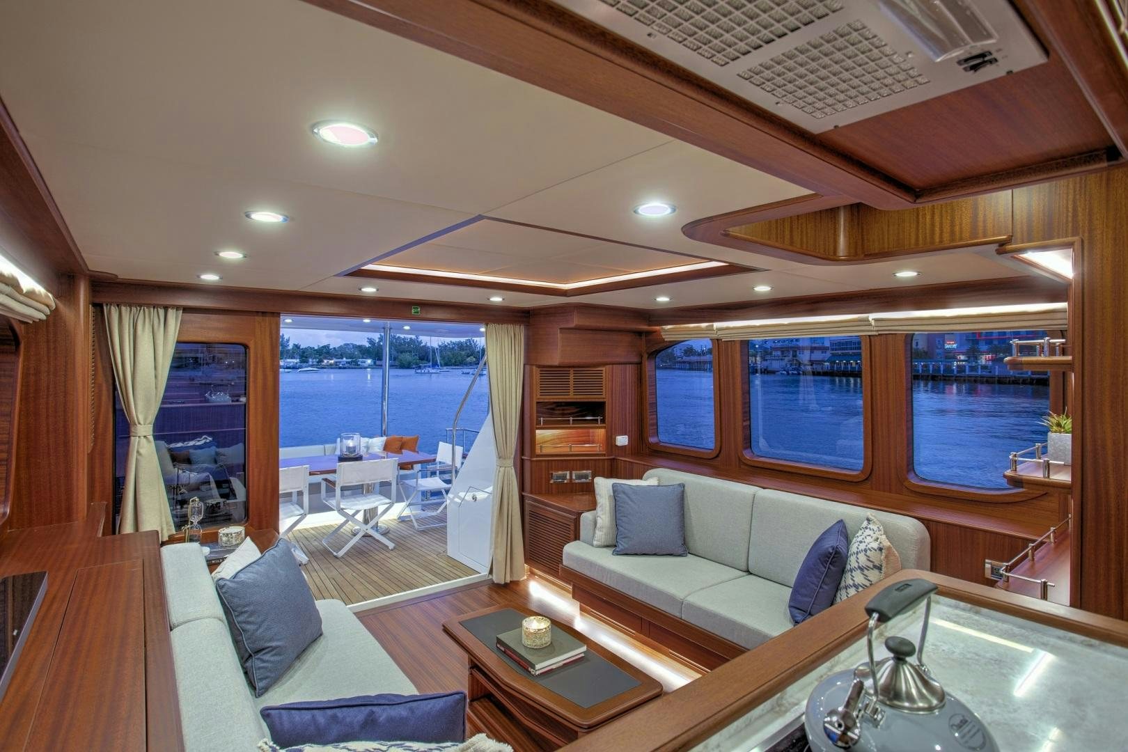 a living room with a large window aboard 67 CRUISER Yacht for Sale