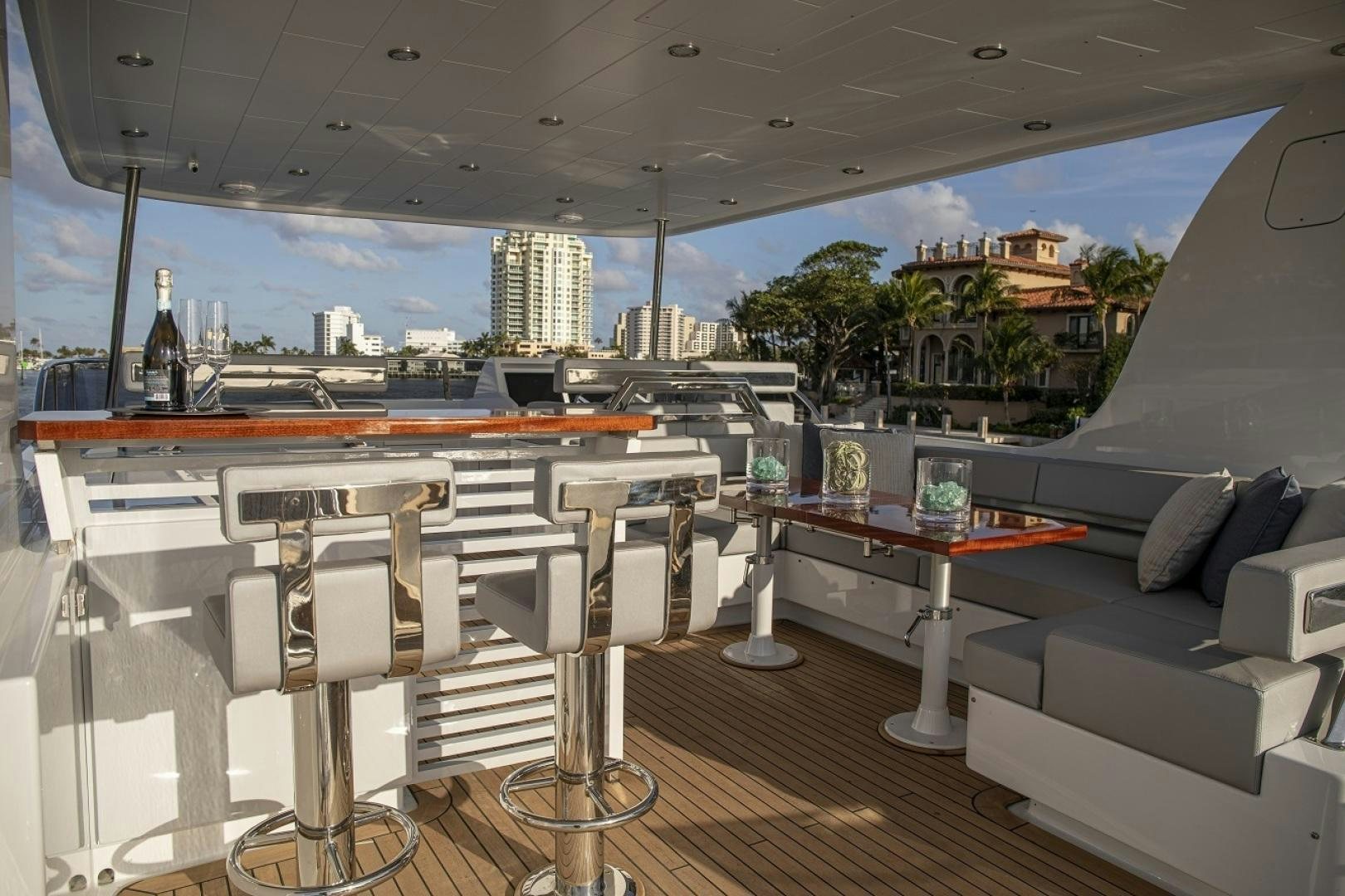 a living room with a large window overlooking a city aboard 67 CRUISER Yacht for Sale