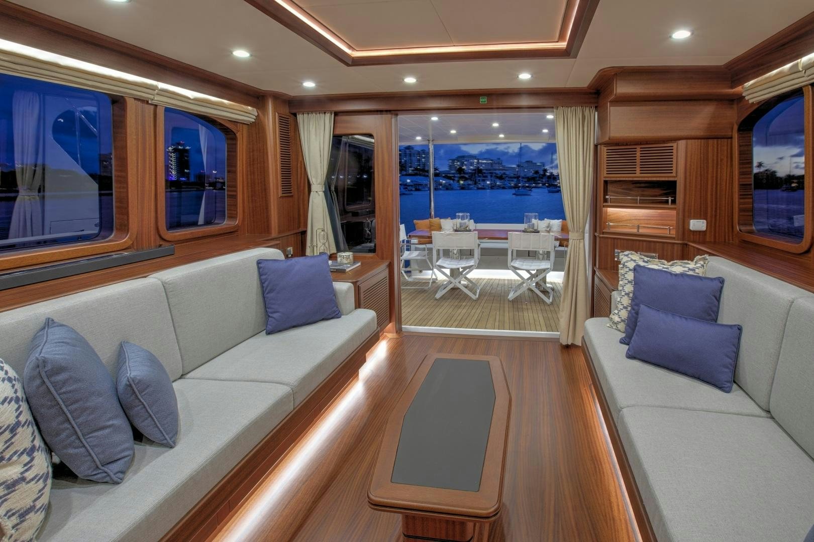 a living room with a large window aboard 67 CRUISER Yacht for Sale