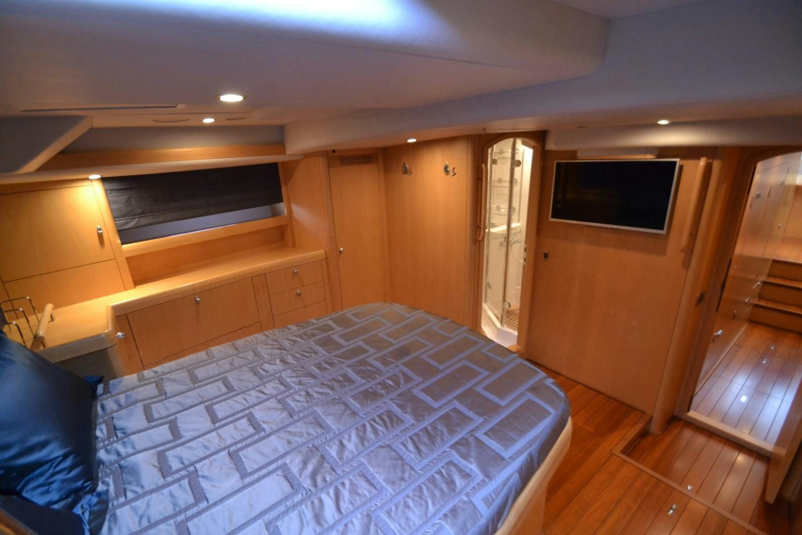 a bedroom with a bed aboard isnl Yacht for Sale