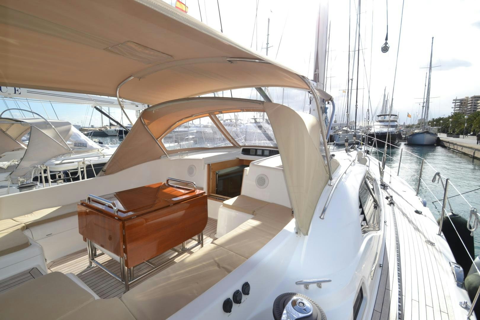 a boat with a desk on the deck aboard isnl Yacht for Sale