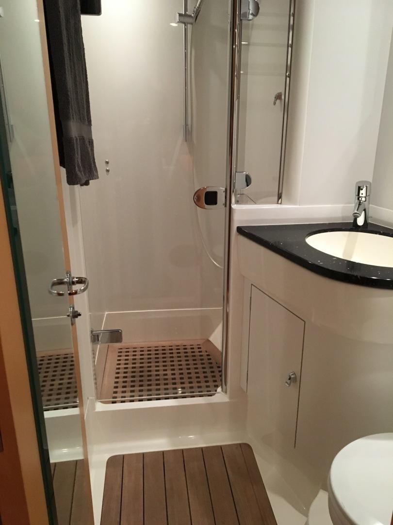 a bathroom with a shower and sink aboard isnl Yacht for Sale