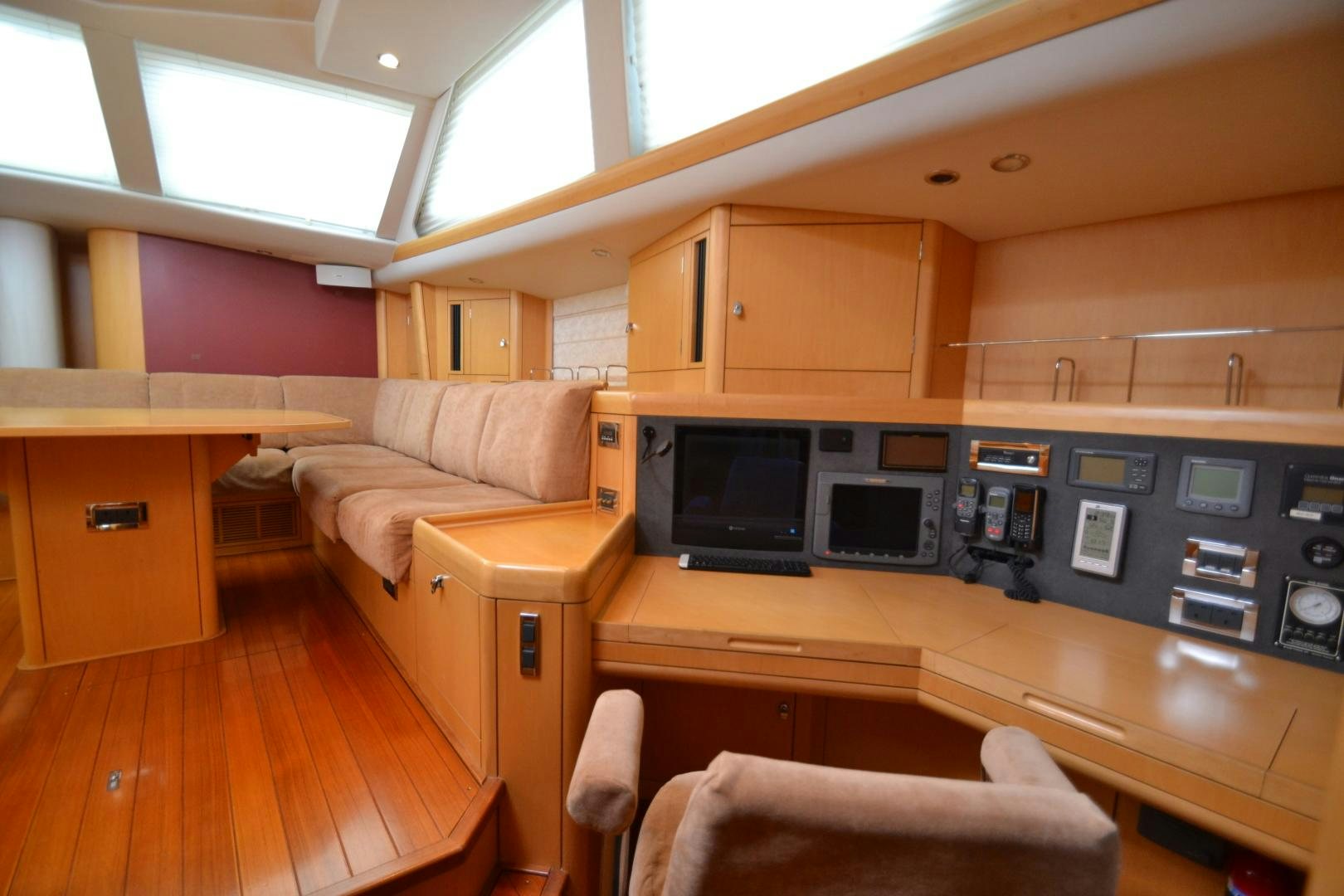 a room with a couch and a table aboard isnl Yacht for Sale