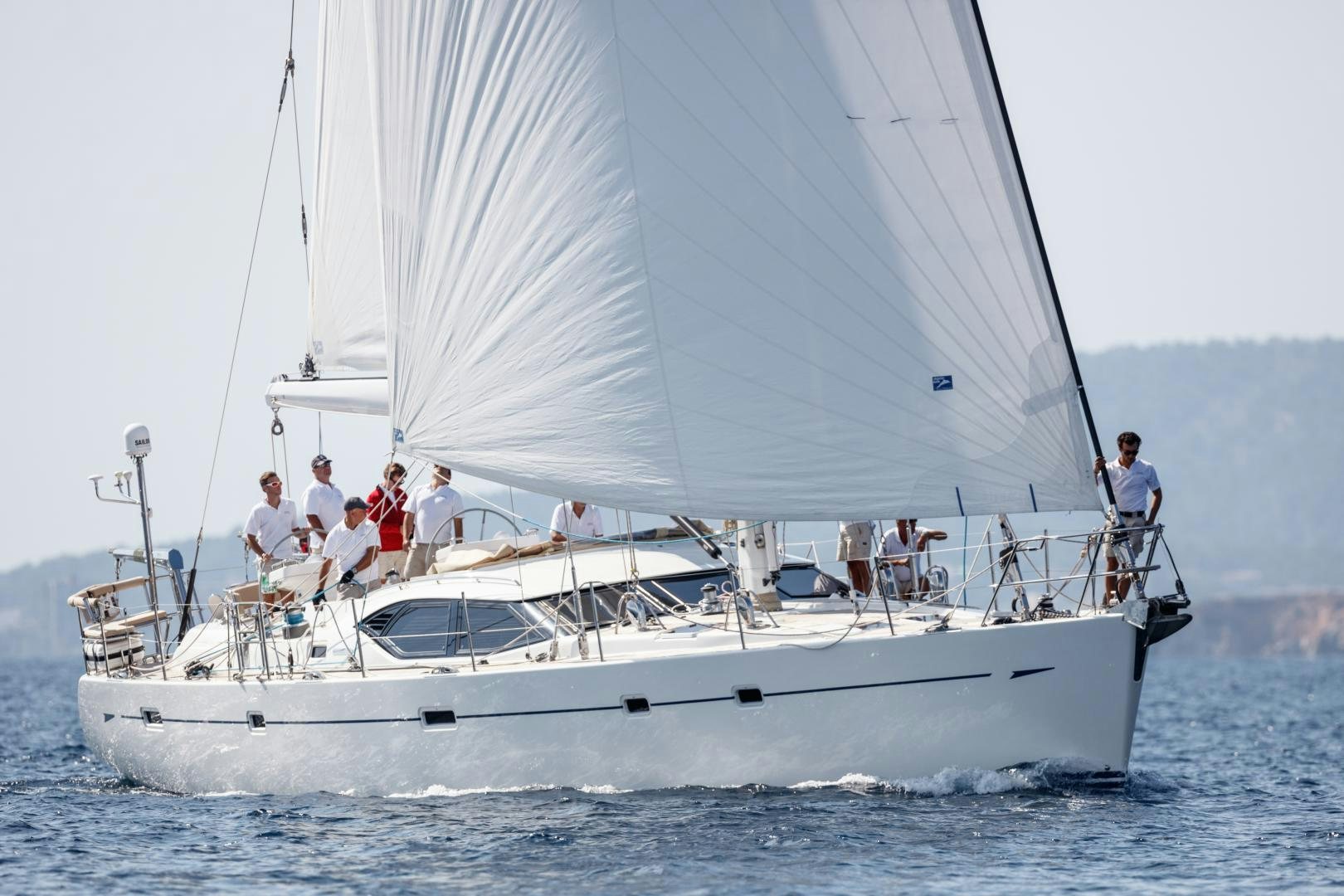 a group of people on a sailboat aboard isnl Yacht for Sale