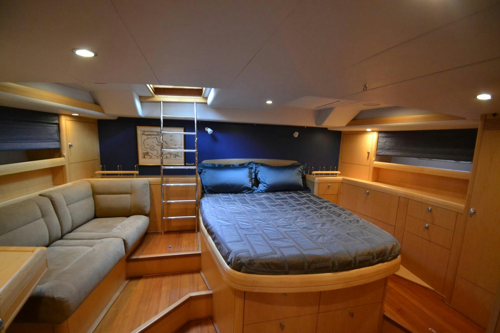 a bedroom with a bed and a couch aboard isnl Yacht for Sale