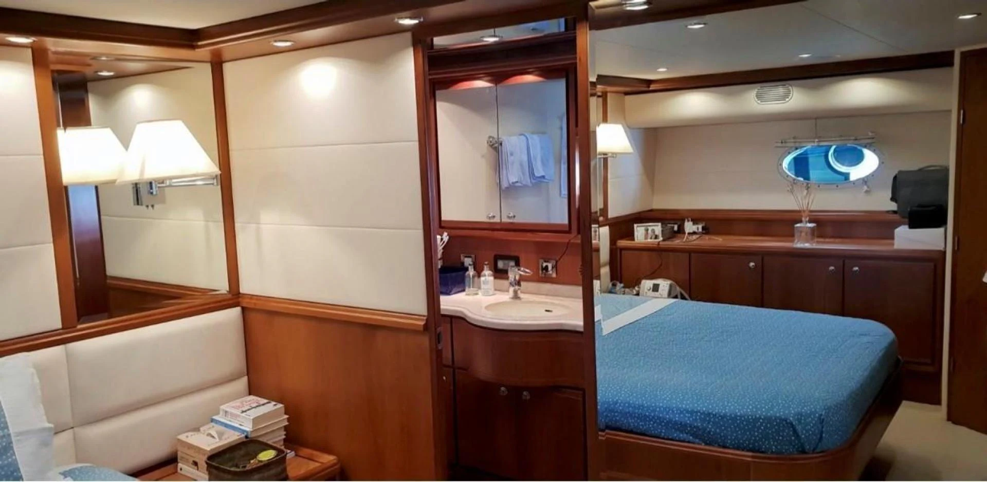 a hotel bathroom with a blue bed aboard BOUKI Yacht for Sale