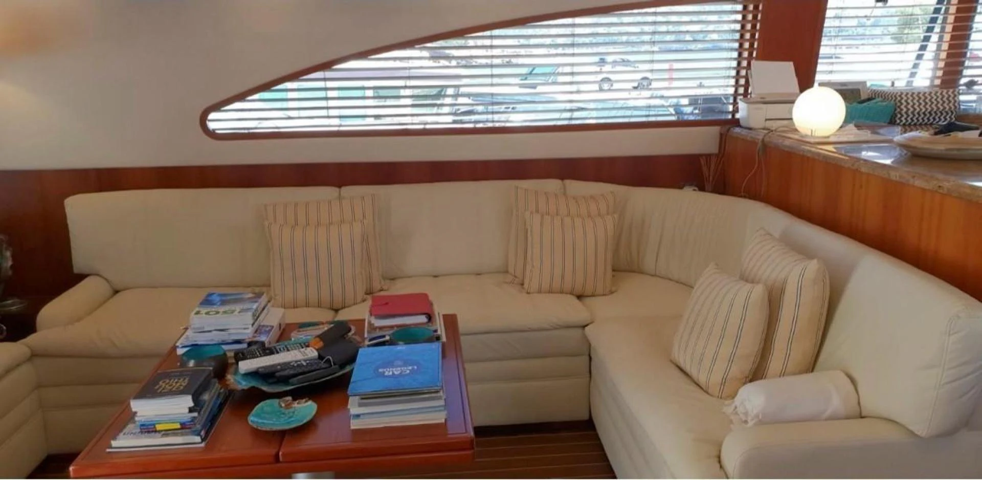 a living room with a couch and coffee table aboard BOUKI Yacht for Sale