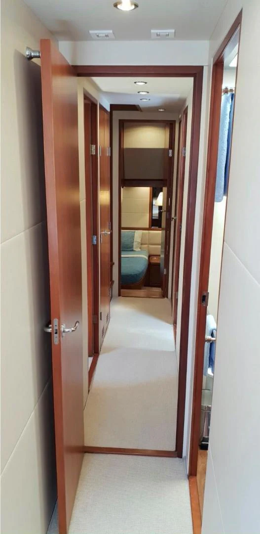 a hallway with doors aboard BOUKI Yacht for Sale